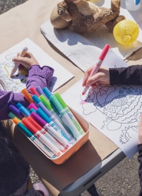 A child drawing with coloured pens
